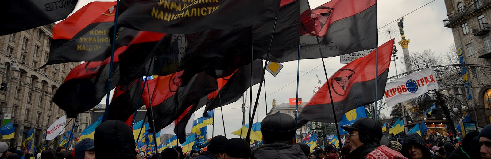 Euromaidan protestors holding blood and soil flags in Kyiv