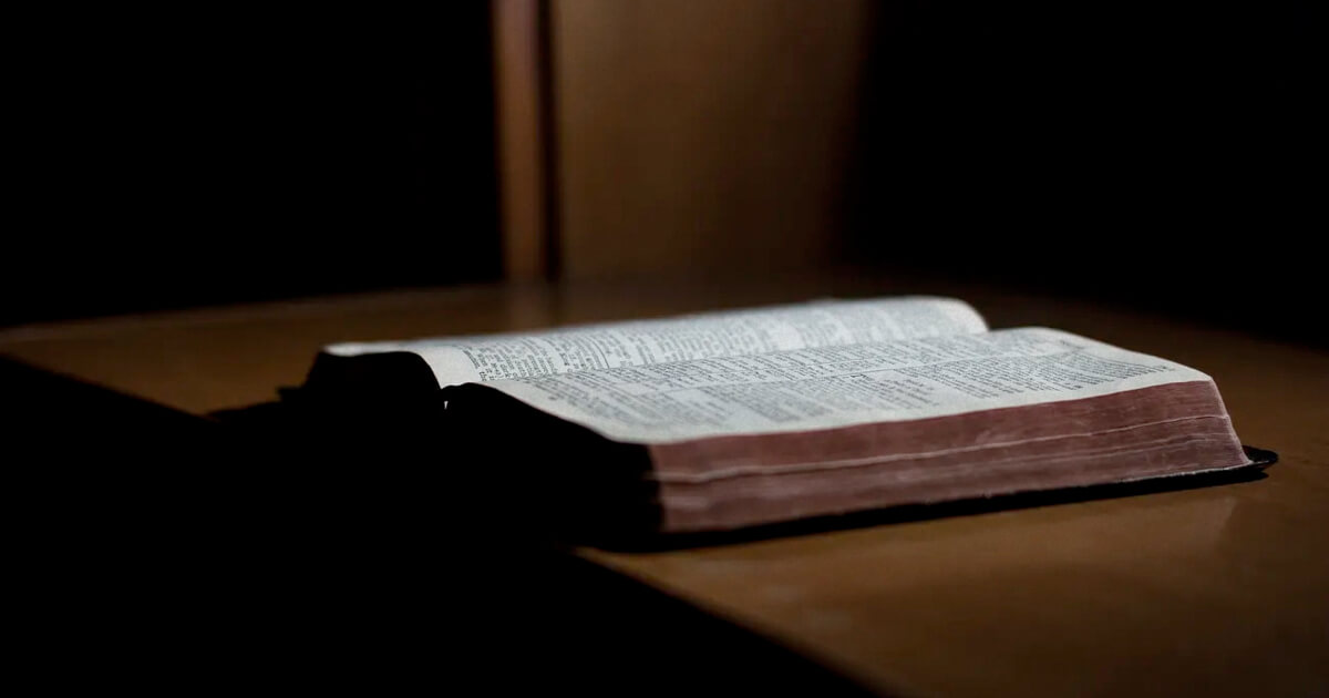 Picture of a Bible on a desk.