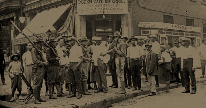 Crowd and armed National Guard soldiers, outside Ogden Cafe, Chicago, 1919
