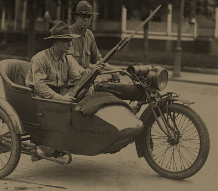 Two military men riding in a motorcycle and sidecar during the Washington race riots of 1919